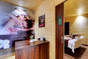 a room with a poster of a woman on the wall at Sumitel Vista 800m from Mall Road in Darjeeling