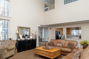 a living room with a couch and a coffee table at Family Getaway-Hot Tub, Ice Castles & Tubing HS home in Midway