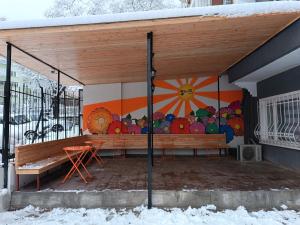a patio with a painting on the side of a building at Deeps Hostel Ankara 2 in Ankara