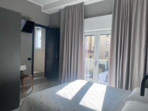 Кровать или кровати в номере Hotel Graziella