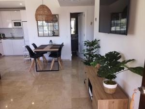 a kitchen and dining room with a table and chairs at Costa del sol, Marina del Mar in Mijas Costa +33 photos