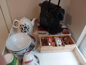 a kitchen counter with a tea set and a tea pot at Hotel Golden Dragon in Dessel