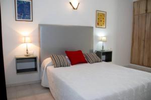 Postel nebo postele na pokoji v ubytování Hostal El Capi