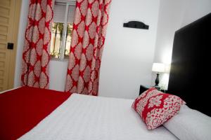 Postel nebo postele na pokoji v ubytování Hostal El Capi
