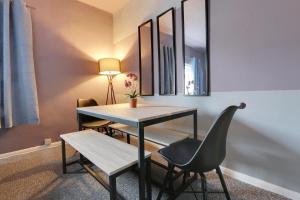 a dining room with a table and a chair at Stylish base on Abbeydale Road in Sheffield