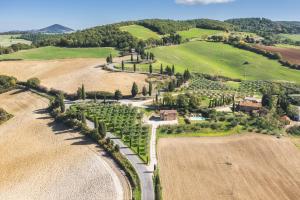 an aerial view of a farm in a field at Agriturismo La Casellina in Monticchiello