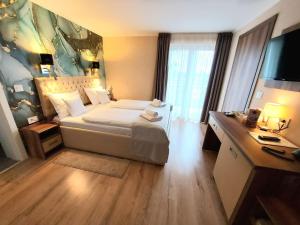 Letto o letti in una camera di Papuli rooms 4U