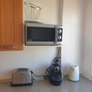 Kuchyňa alebo kuchynka v ubytovaní Beach Front Sea View Punta Prima