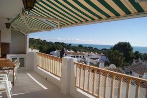 a balcony with a view of the ocean at Las Haciendas Marineu in Alcossebre