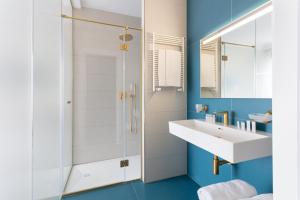 a bathroom with a sink and a shower at Experience Boutique Hotel - Villa Cimmino in Castellammare di Stabia