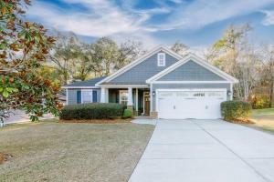 a house with a garage and a driveway at Manassas House 4 BDR Patio Firepit in Tallahassee