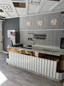 a hotel lobby with a reception desk at Hotel Stella D'Italia - Nuova gestione in Rimini