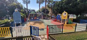 a playground in a park with a play area at PLAYA RINCON De LA VICTORIA in Rincón de la Victoria