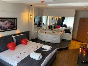 A bed or beds in a room at Kanarya Suite