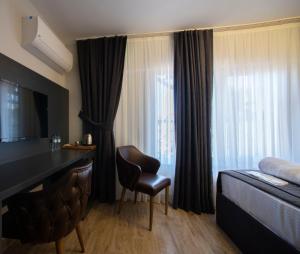 A bed or beds in a room at Kanarya Suite