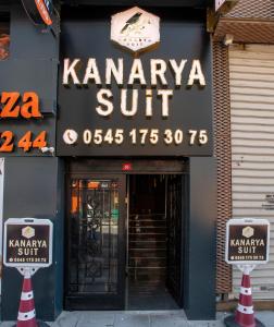 a sign for a kaanapaliikiniikiniikiniikini on a building at Kanarya Suite in Istanbul