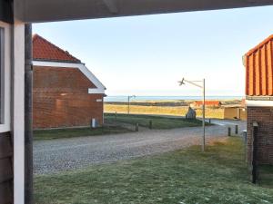 a view of a dirt road next to a brick building at 6 person holiday home in Lemvig in Lemvig