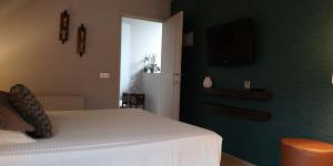 Postel nebo postele na pokoji v ubytování B&B de Taller-Hoeve
