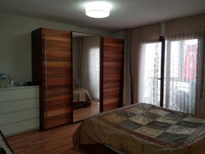 a bedroom with a bed and a dresser and a mirror at Ata in Istanbul