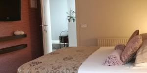 Postel nebo postele na pokoji v ubytování B&B de Taller-Hoeve