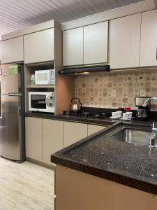 Η κουζίνα ή μικρή κουζίνα στο Aconchego de 2 dorm - 5 km Centro Gramado