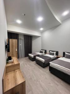 Katil atau katil-katil dalam bilik di Rever Hotel