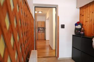 a hallway with a door leading into a room at Apartmán Ivka in Brezno