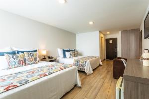 Postel nebo postele na pokoji v ubytování Hotel Carretero