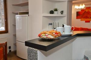 a kitchen with a counter with a bowl of food on it at Apartmán Ivka in Brezno