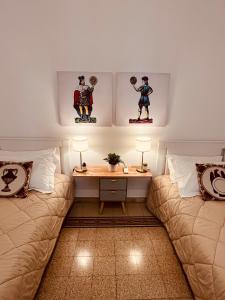 מיטה או מיטות בחדר ב-Palermo Center Residenza IN Cattedrale Superior Apartment