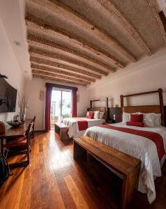Postel nebo postele na pokoji v ubytování Hotel Boutique Casa San Diego + 37 fotografií