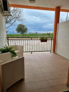 a screened porch with a view of a field at Pepe rosa in Termoli