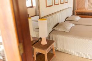 Postel nebo postele na pokoji v ubytování Santa Clara Hotel