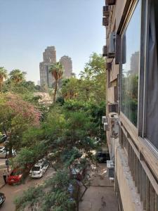 a window of a building with a view of a city at Room 2 in Cairo