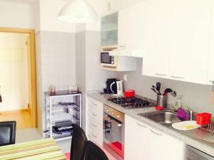a kitchen with a sink and a stove top oven at Luxury Lisbon Apartment. With Air Con. in Lisbon