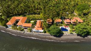 an aerial view of a house on the beach at Bondalem Beach Club in Tejakula