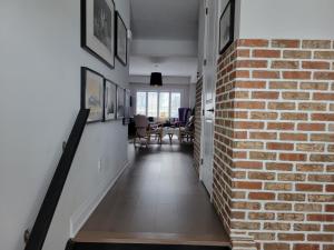 a brick hallway with a brick wall and a dining room at Exclusive Townhome near West-Side Trails in Waterloo