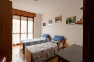A bed or beds in a room at Appartamento vista Alpi biellesi