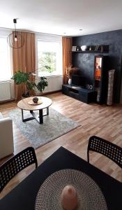 a living room with a coffee table and a couch at Apartament u Edka przy Dolnej II in Świeradów-Zdrój