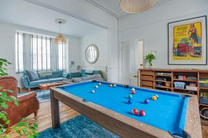 a living room with a pool table at The Broadstairs Townhouse in Broadstairs