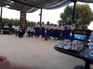 a group of people standing next to a table with glasses at Pensiunea EDEN in Crisan +23 photos