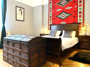 a bedroom with a bed and a large rug at Casa Irina in Braşov