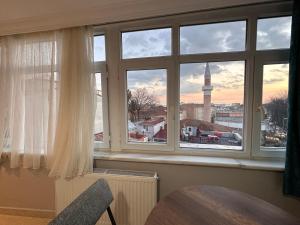 a window with a view of the clock tower at Asparagus HOTEL & SUITES OLD CITY in Istanbul