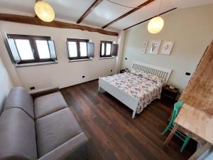 Postel nebo postele na pokoji v ubytování B&B L'orto del Geo
