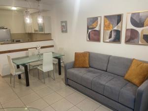 a living room with a couch and a table at Beautiful apartment in center of Jerusalem in Jerusalem