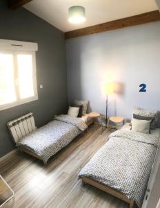 Ένα ή περισσότερα κρεβάτια σε δωμάτιο στο Team House - 8 lits +21 φωτογραφίες