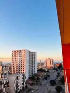 a view of a city street with tall buildings at Standing de luxe, surface de 150 m Paiement uniquement en euros in Oran