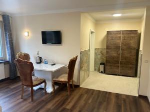 TV a/nebo společenská místnost v ubytování M&M Hotel - Seevetal