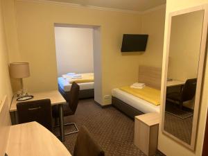 Postel nebo postele na pokoji v ubytování M&M Hotel - Seevetal