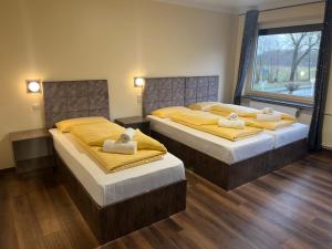 Postel nebo postele na pokoji v ubytování M&M Hotel - Seevetal
